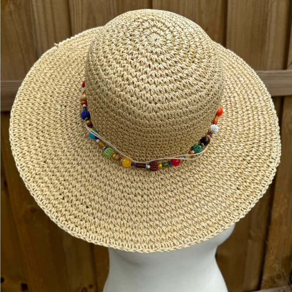 Cappelli New York cream straw hat with colorful beaded band.Like new condition.